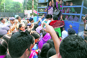 Women UPNL employees court arrest in support of their demands;