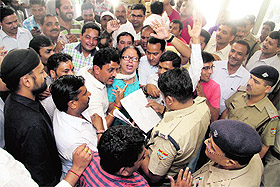 BJP workers hold a protest at the SSP office in Dehradun on Tuesday against rise in crime.