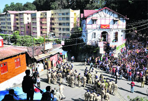 Activists of the SFI hold a chakka jam against fee hike at HPU in Shimla on Wednesday.