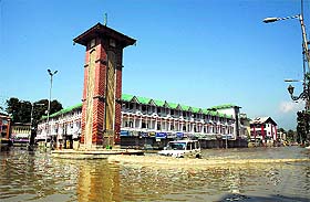 A vehicle passes through the Lal Chowk area of Srinagar as the floodwaters recede on Wednesday.