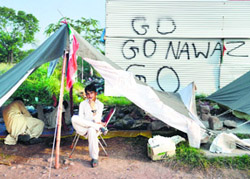 Supporters of Imran Khan rest inside a tent during the ongoing anti-government protests in front of Parliament in Islamabad on Wednesday.