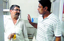 One of the CTU officials (left), who was caught drinking on duty at the Sector 43 ISBT on Thursday