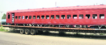 Rakes of a rail being dispatched via road on the Jalandhar-Phagwara road on Thursday.