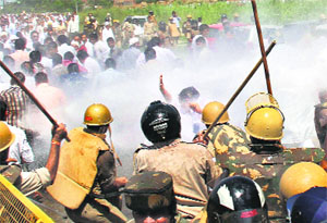 Police lathi-charge RLD supporters protesting the Centres decision to cut off the power supply to party president Ajit Singhs New Delhi bungalow, at Muradnagar in Ghaziabad on Thursday.