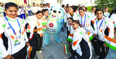 Indian athletes pose with the official mascot of the Games during the flag hoisting ceremony of the 17th Asian Games in Incheon, South Korea