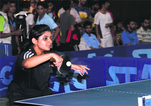 A player plays the ball back in a match in the North Zone Inter-University Table Tennis Tournament at the multipurpose sports complex in Dehradun on Thursday.