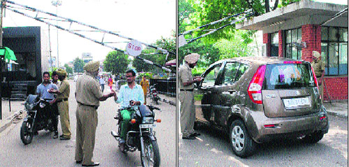 Vehicle owners are questioned before letting them in on the GNDU campus in Amritsar on Friday