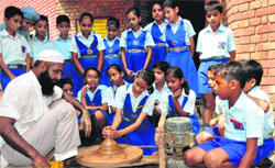 Students take part in a pottery workshop at Tribune Model School in Sector 29, Chandigarh, on Friday. Tribune photo: Parvesh Chauhan