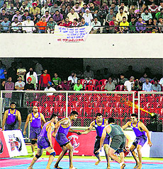Players in action during the Kabaddi League match in Jalandhar on Friday