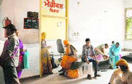 Patients wait for doctors at the Civil Hospital in Ludhiana on Friday.