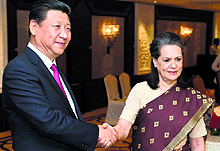 Congress president Sonia Gandhi greets Chinese President Xi Jinping in New Delhi on Friday