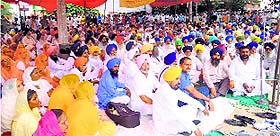 Villagers protest in Amloh on Friday.