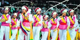 Dancers in traditional costumes perform on Friday night.