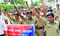 PRD personnel protest in front of the Secretariat in Dehradun on Friday