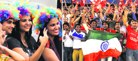 Fans cheer for Kings XI Punjab during a CLT20 match against Barbados Tridents at the PCA Stadium, Mohali, on Saturday.