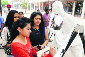 Girls take part in a signature campaign at Sector 17, Chandigarh, on Saturday.