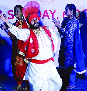 Folk artists performing a Gidda at Dilli Haat Janak Puri, organised by the Punjabi Academy under a cultural initiative by Delhi Tourism in New Delhi on Saturday.