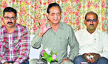 BJP senior leader Kishan Kapoor addresses mediapersons in Dharamsala on Saturday
