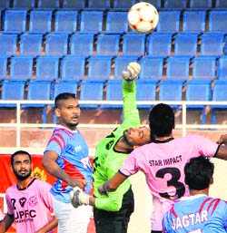 Players in action during the JCT Punjab State Super Football League in Jalandhar on Saturday.