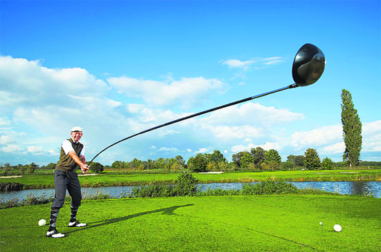 Recent undated handout pictures released by the Guinness World Records show 49-year-old trick golf artist Karsten Maas, from Denmark, who secured his place in the 2015 Guinness World Records book for creating the world’s longest usable golf club.