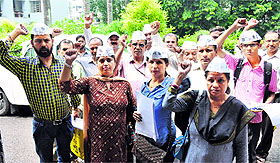 Workers of the Aam Aadmi Party protest at the District Magistrates office in Dehradun on Saturday.