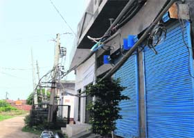 Power cable touches gates of houses and shops at Ram Avenue in Amritsar