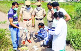 Policemen and forensic experts inspect the spot where the body parts were found at Sector 28, Panchkula, on Sunday.