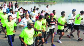Navi Mumbai-based Kripa Sagar (in black t-shirt) takes part in a marathon at Sukhna Lake on Sunday.
