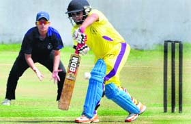 A player hits a shot during the First Rama Atray Memorial Women Cricket Tournament match between Delhi and Punjab at Sector 26 in Chandigarh.