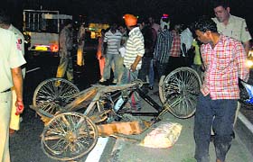 The rehri that overturned after being hit by a vehicle near Kala Gram in Chandigarh on Sunday.