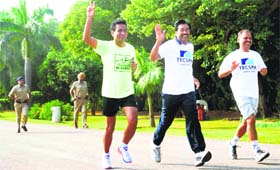 As UT Home Secretary Anil Kumar (centre) and two others took part in a marathon race at Sukhna Lake on Sunday, two policemen in uniform had no option but to follow suit. Wearing leather shoes, they had a hard time keeping pace with their boss!
