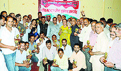 Agents of the best booths of the BJP being honoured by MP Ramswaroop Sharma and MLA Jai Ram Thakur in Mandi on Sunday
