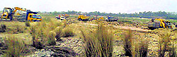 JCBs and stone crushers on the Chakki riverbed