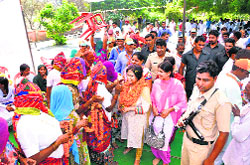BJP candidate Sunita Setia being welcomed by rural women in a village in Sirsa. 