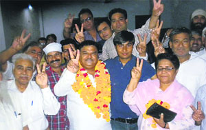 A file photo of Chander Bhatia (garlanded) with his supporters