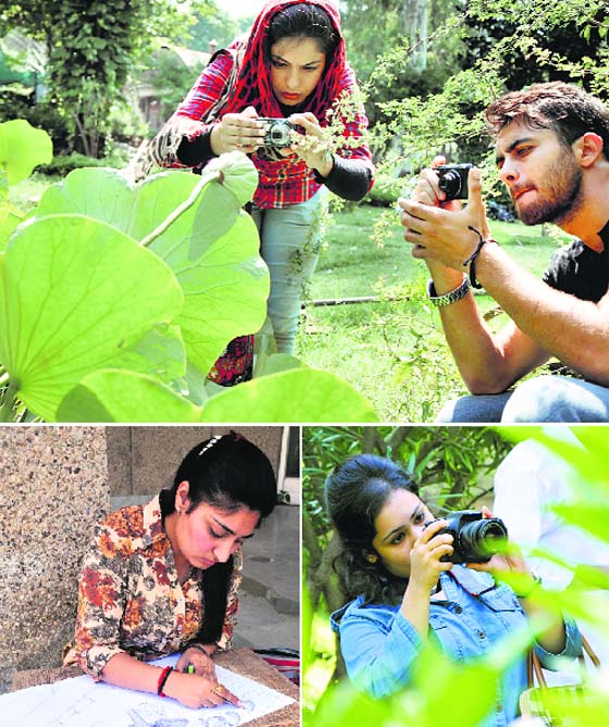 Displaying talent: Students participate in the photography and sketching competitions at the University of Jammu on Sunday.