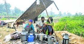 A Gujjar family lives in the open after their house was damaged by floods in the Jammu region.