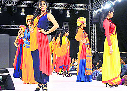 Models showcase creations of budding designers during the Annual Designers' Contest of the INIFD in Ludhiana