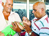 A kid being administered polio drops on the first day of the pulse polio drive in Ludhiana on Sunday