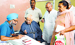 A doctor checks a patient during a medical camp at Dandi Swami Mandir
