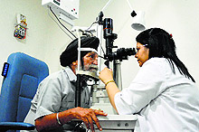 A man undergoes an eye test at Guru Teg Bahadur Sahib Charitable Hospital