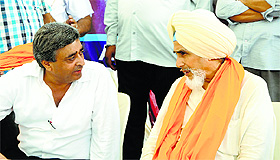 AAP convener SS Chhotepur with former party convener Ashok Talwar in Amritsar on Sunday.