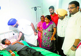 Punjab Health Systems Corporation chairman Barjinder Singh Brar interacts with a diarrhoea patient at the District Hospital in Moga on Sunday.