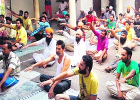 Jail inmates undergoing treatment at a de-addiction centre participate in the Art of Living session at Amritsar Central Jail