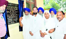 Animal Husbandry Minister Gulzar Singh Ranike inaugurates animal husbandry building at Kartarpur on Monday.
