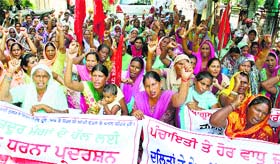 Activists of the Pendu Mazdoor Union, Punjab, protest in support of their demands in front of the Zila Parishad office in Jalandhar on Monday.