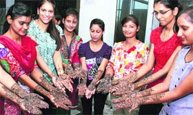 Students showing mehendi during the talent hunt competition at St Soldier College in Jalandhar on Monday.