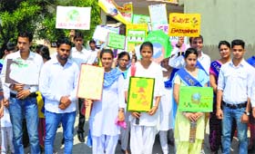 Students of the GMT College of Education take out a rally to create awareness on environment conservation in Ludhiana.