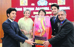 Winners of the All-India Shri Naveen Agarwal Memorial Inter-School English Debate with trophy in Dehradun on Monday. A Tribune photograph