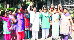 BJP women workers protest against illegal hostels being run in residential areas in Dehradun on Monday. A Tribune photograph
